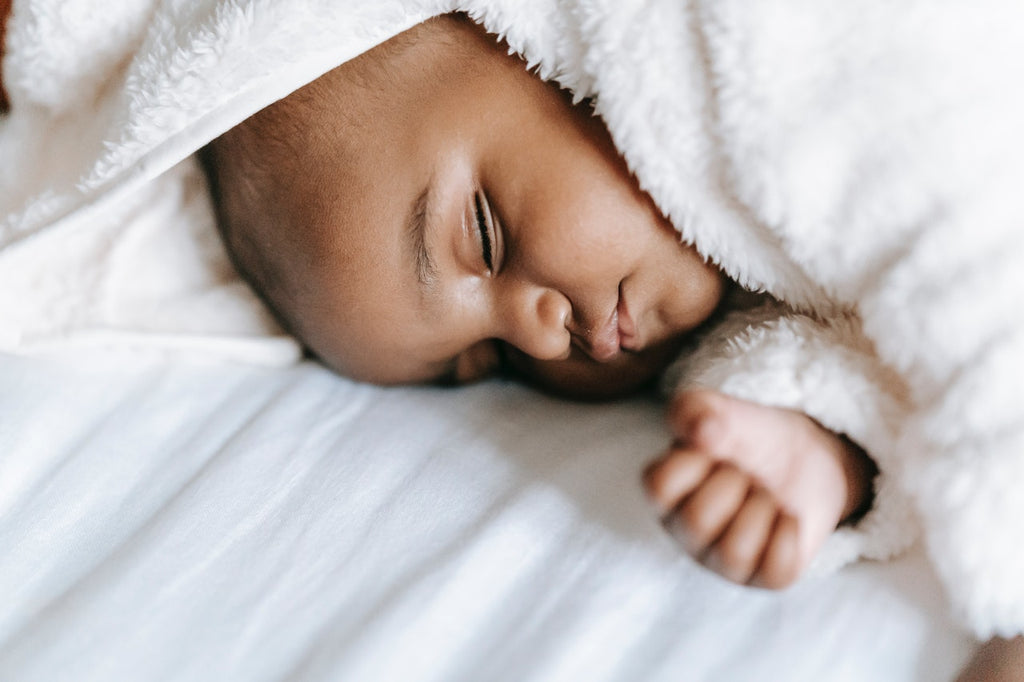 Sleeping with best sale newborn in bed